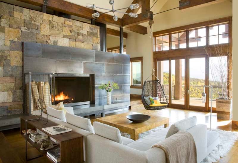 Design ideas for a rustic living room in Denver with feature lighting.