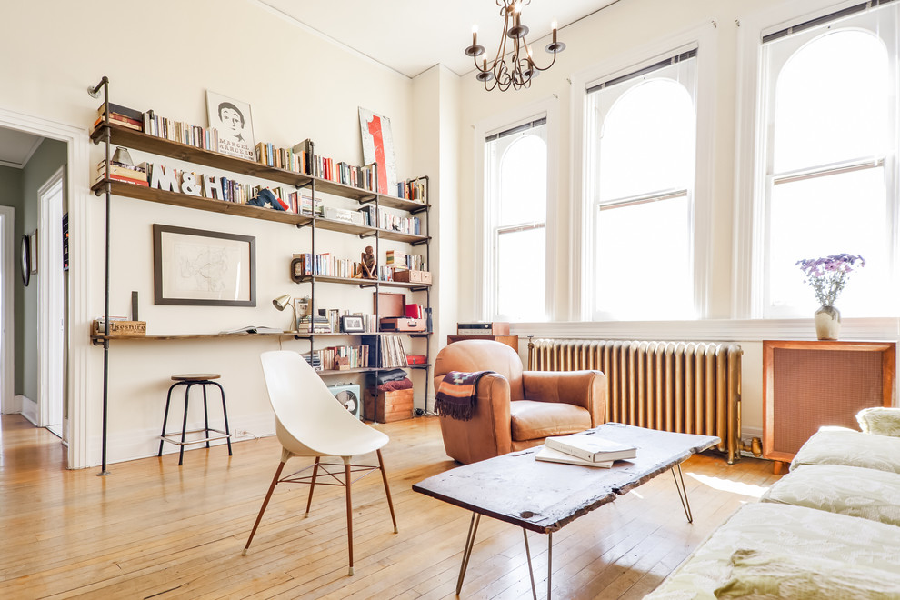 Inspiration for a mid-sized scandinavian open concept light wood floor living room remodel in Denver with white walls, no fireplace and no tv