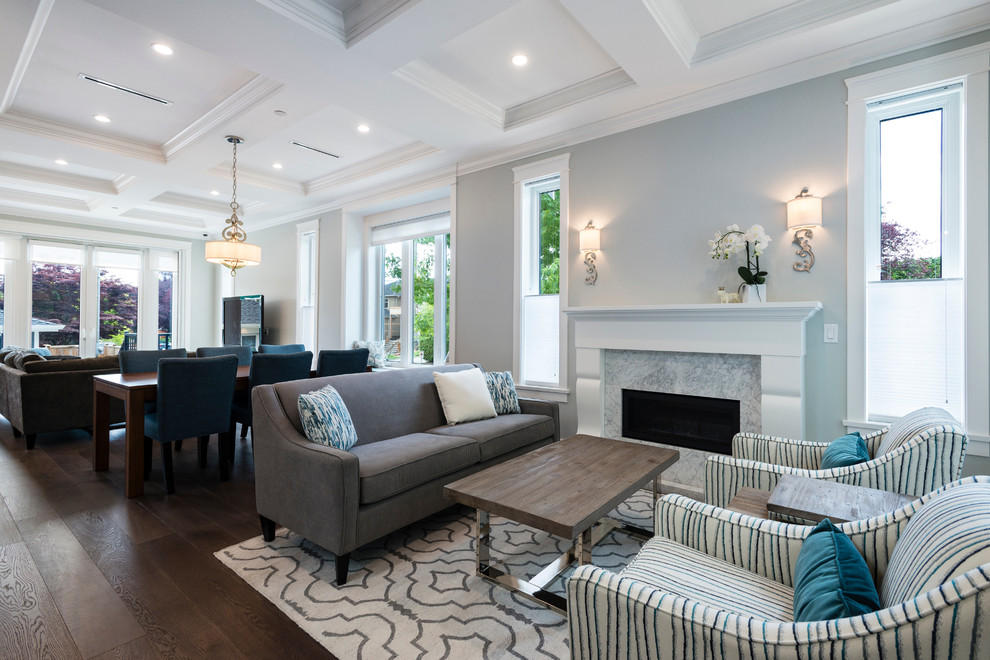 Mid-sized transitional open concept dark wood floor and brown floor living room photo in Vancouver with gray walls, a standard fireplace and a media wall