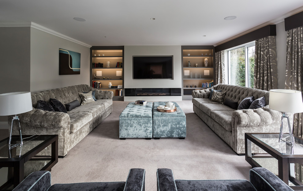Expansive contemporary formal and grey and white enclosed living room in Hertfordshire with carpet, a wall mounted tv, grey walls, a plastered fireplace surround and beige floors.