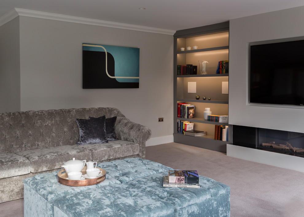 Expansive contemporary formal and grey and white enclosed living room in Hertfordshire with carpet, a wall mounted tv, grey walls, a plastered fireplace surround and beige floors.