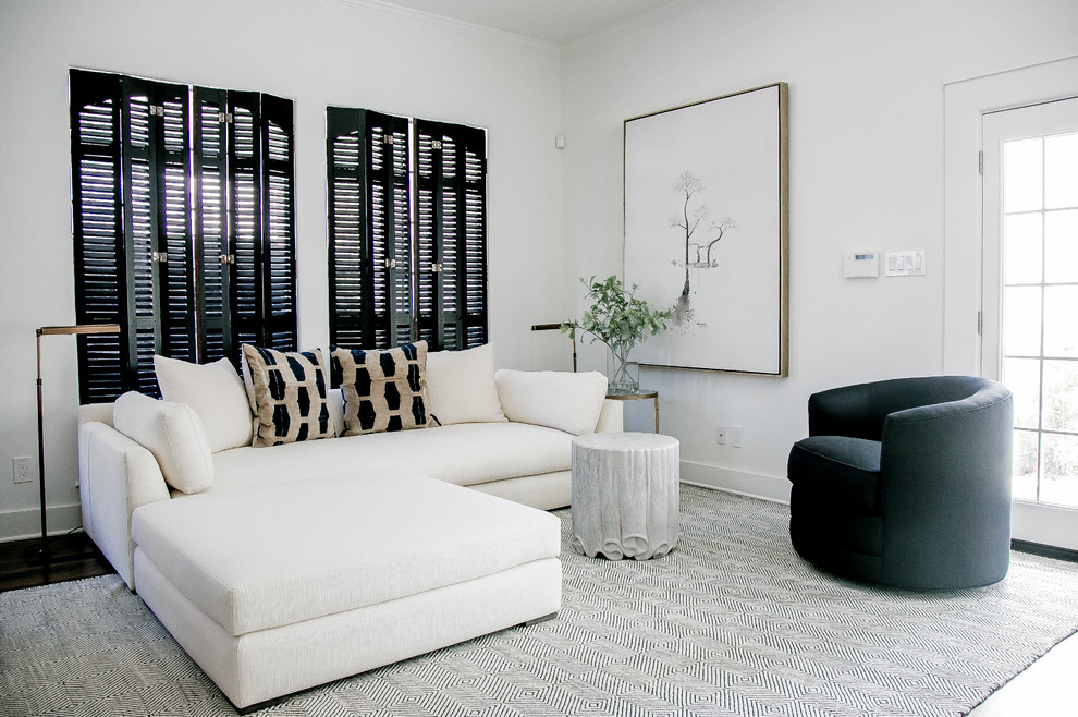 Example of a transitional dark wood floor living room design in Houston with white walls and no fireplace