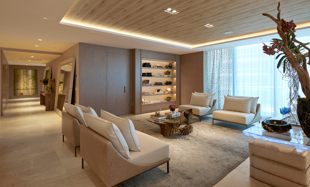 Esempio di un grande soggiorno contemporaneo aperto con pavimento beige