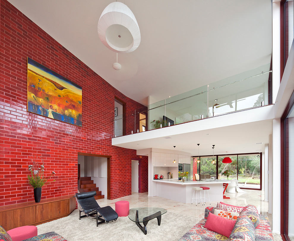 Contemporary open plan living room in Melbourne with red walls.