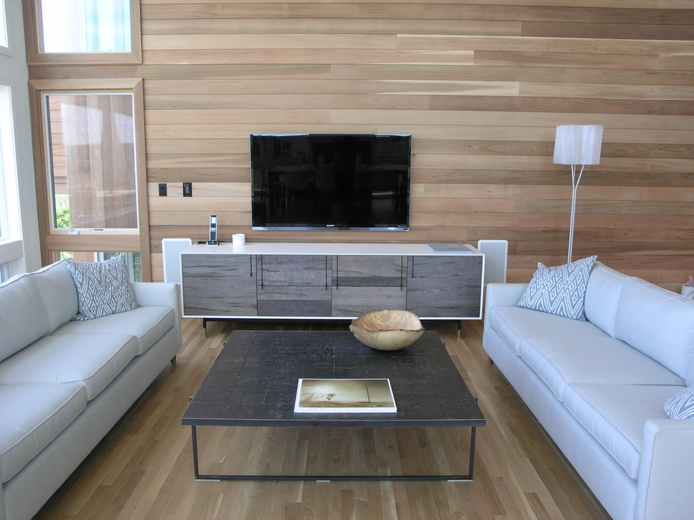 Large trendy open concept light wood floor living room photo in New York with brown walls, a standard fireplace, a stone fireplace and a wall-mounted tv