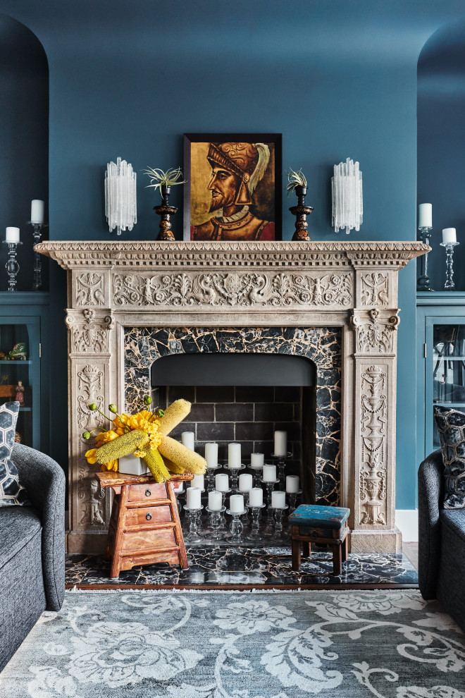 Inspiration for a mid-sized eclectic formal and enclosed dark wood floor living room remodel in San Francisco with blue walls, a standard fireplace, a stone fireplace and no tv