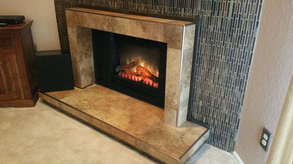 Photo of a classic living room in Phoenix with beige walls, carpet, a standard fireplace and a tiled fireplace surround.