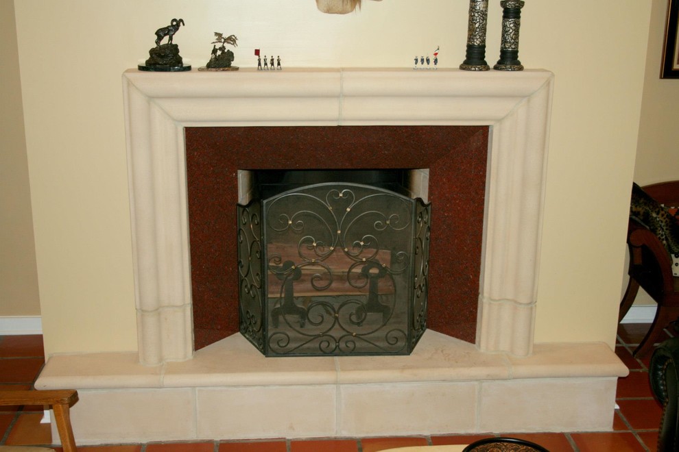 Photo of a traditional living room in Other with terracotta flooring, a standard fireplace and a stone fireplace surround.