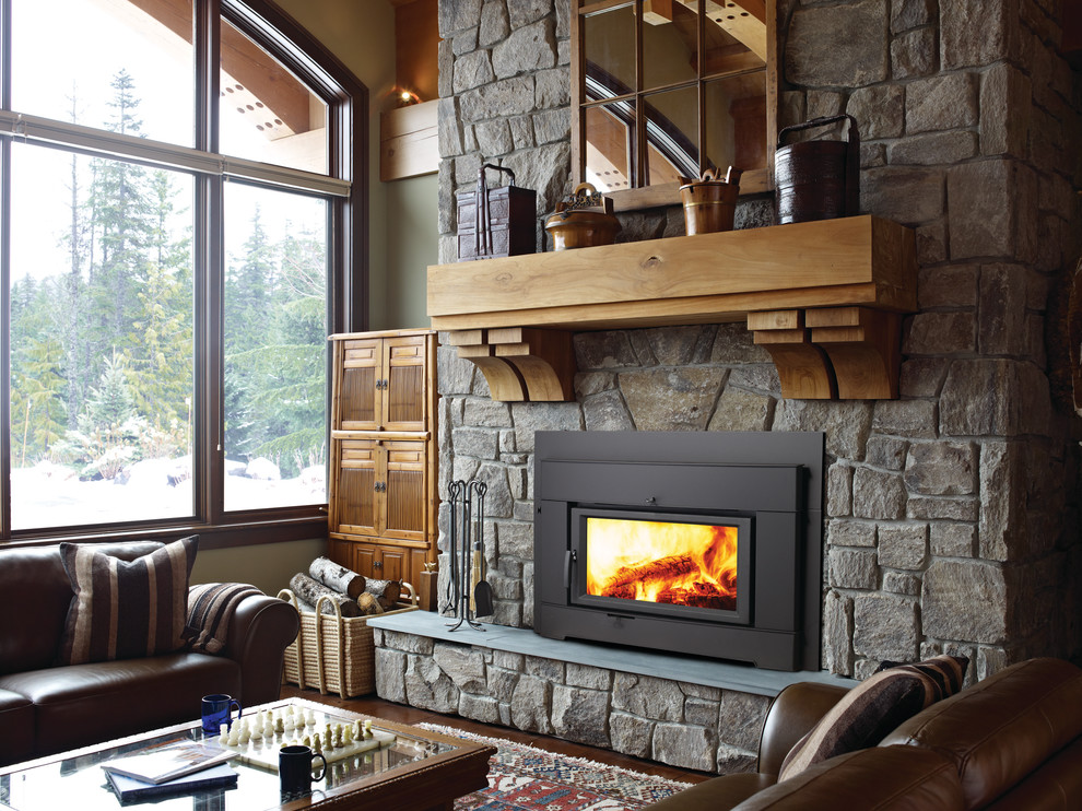 Enclosed living room photo in Seattle with a standard fireplace and a stone fireplace