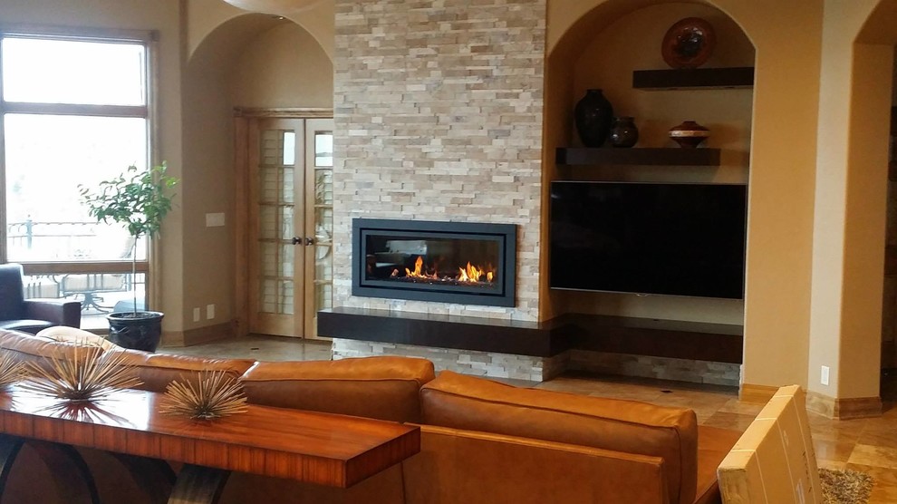 Photo of a large contemporary formal open plan living room in Omaha with beige walls, a ribbon fireplace, a stone fireplace surround, a wall mounted tv, beige floors and porcelain flooring.