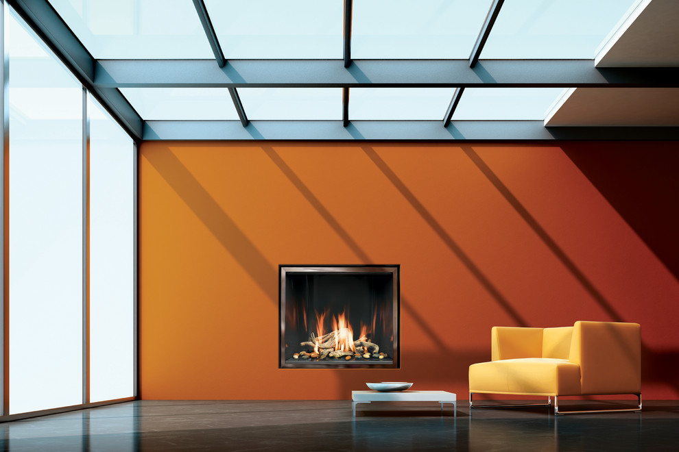 Ispirazione per un soggiorno minimalista di medie dimensioni e chiuso con libreria, pareti arancioni, pavimento in cemento e parete attrezzata