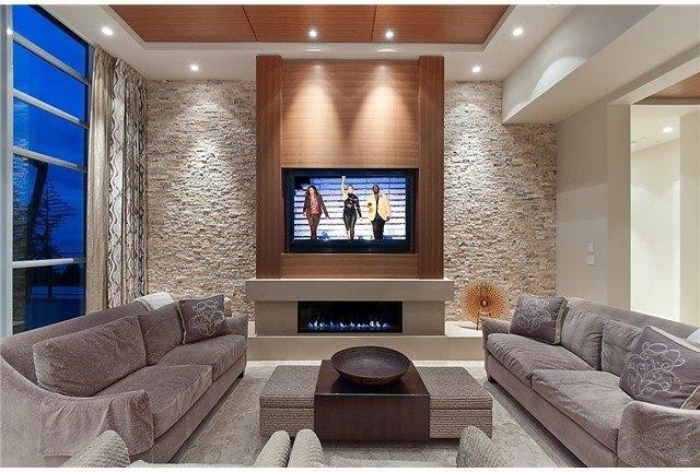 Large classic living room in Vancouver with beige walls, carpet, a ribbon fireplace, a concrete fireplace surround and a wall mounted tv.