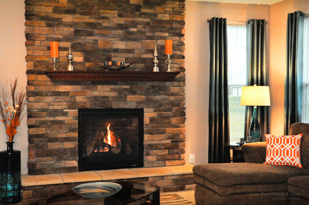 Example of a mid-sized classic formal and enclosed beige floor living room design in Cleveland with beige walls, a standard fireplace, a stone fireplace and no tv