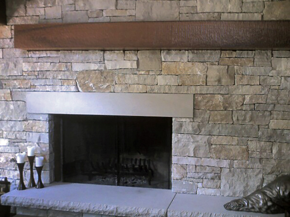 Inspiration for a mid-sized timeless living room remodel in Other with a standard fireplace and a stone fireplace