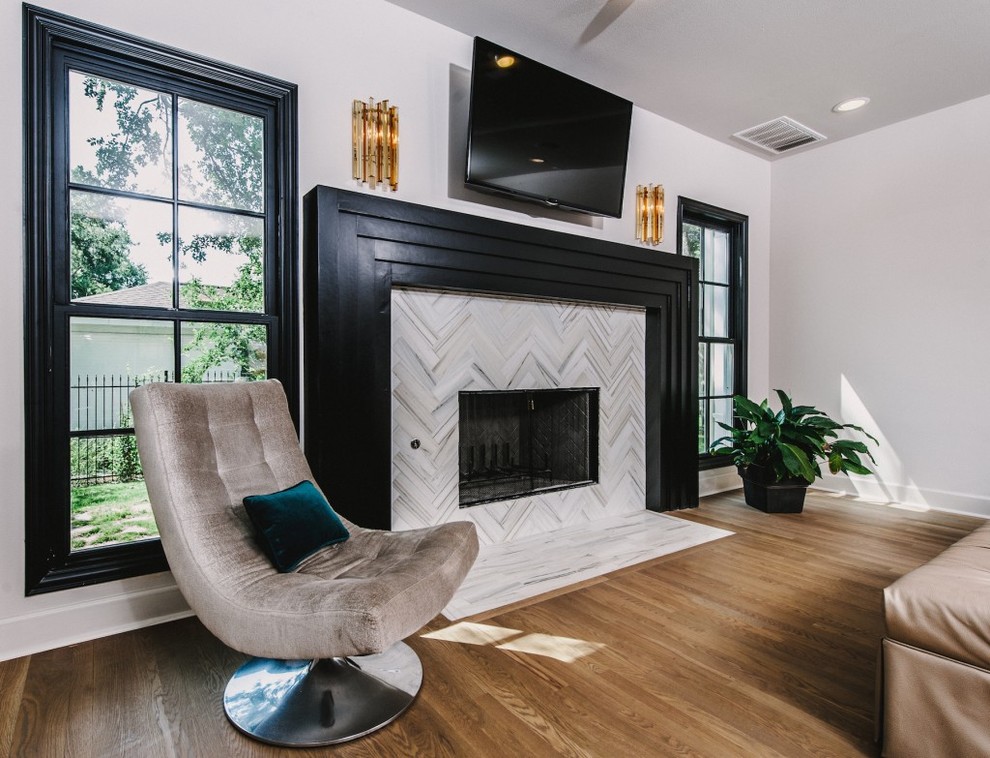 Example of a mid-sized minimalist open concept light wood floor living room design in Austin with purple walls, a standard fireplace, a tile fireplace and a wall-mounted tv