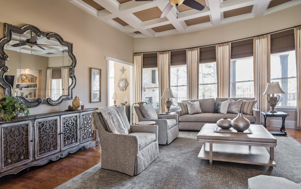 Medium sized classic formal and grey and cream enclosed living room in Charlotte with beige walls, medium hardwood flooring, a standard fireplace, a plastered fireplace surround, a wall mounted tv and brown floors.