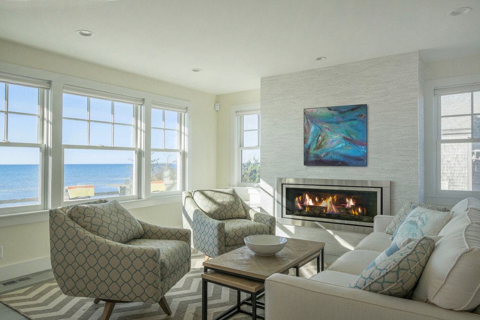 Design ideas for a small beach style open plan living room in Boston with white walls, a standard fireplace, a tiled fireplace surround and no tv.