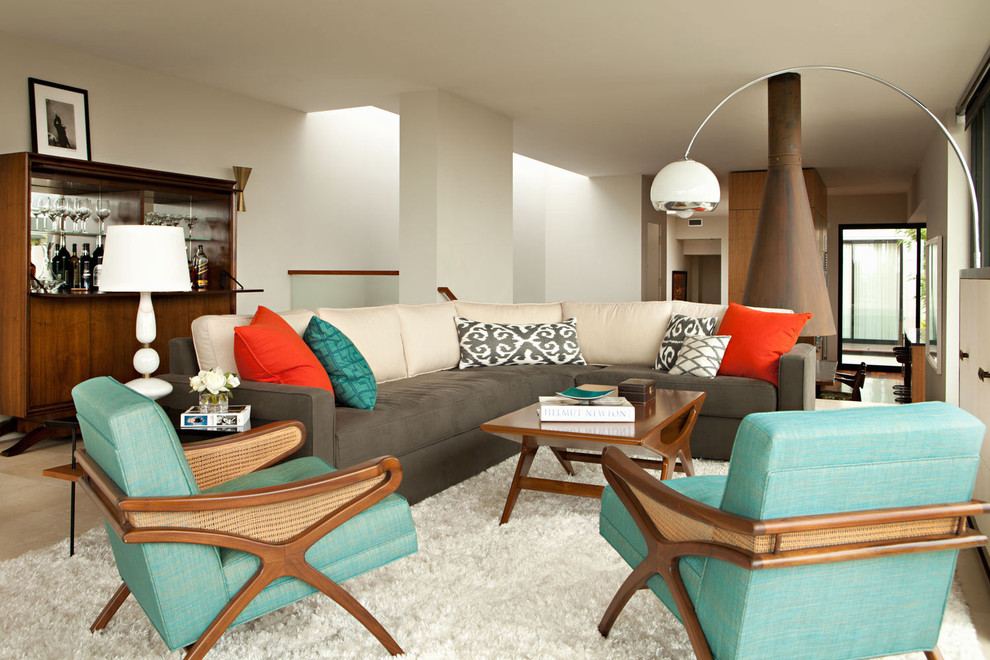 Example of a minimalist living room design in Los Angeles with white walls