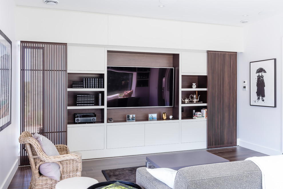 Design ideas for a contemporary living room in Toronto with white walls, dark hardwood flooring, a built-in media unit and brown floors.