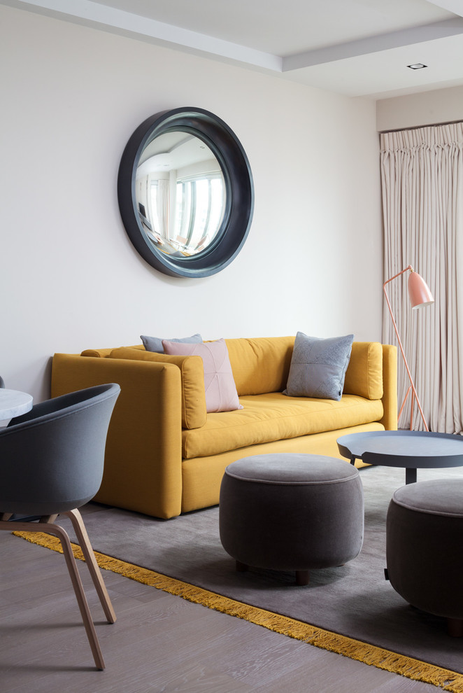 Photo of a midcentury grey and yellow living room in Kent.