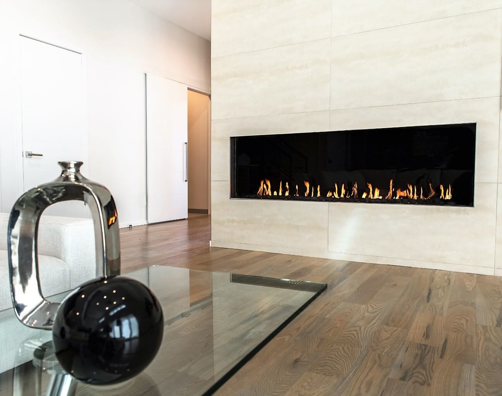 Example of a trendy living room design in Dallas with a standard fireplace