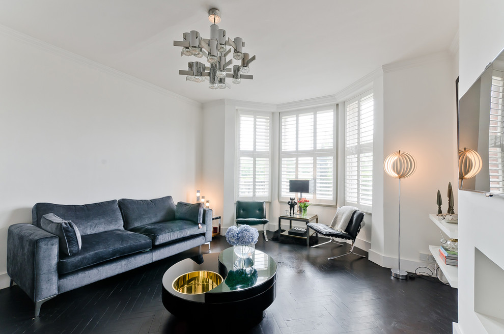 Example of a trendy black floor living room design in London