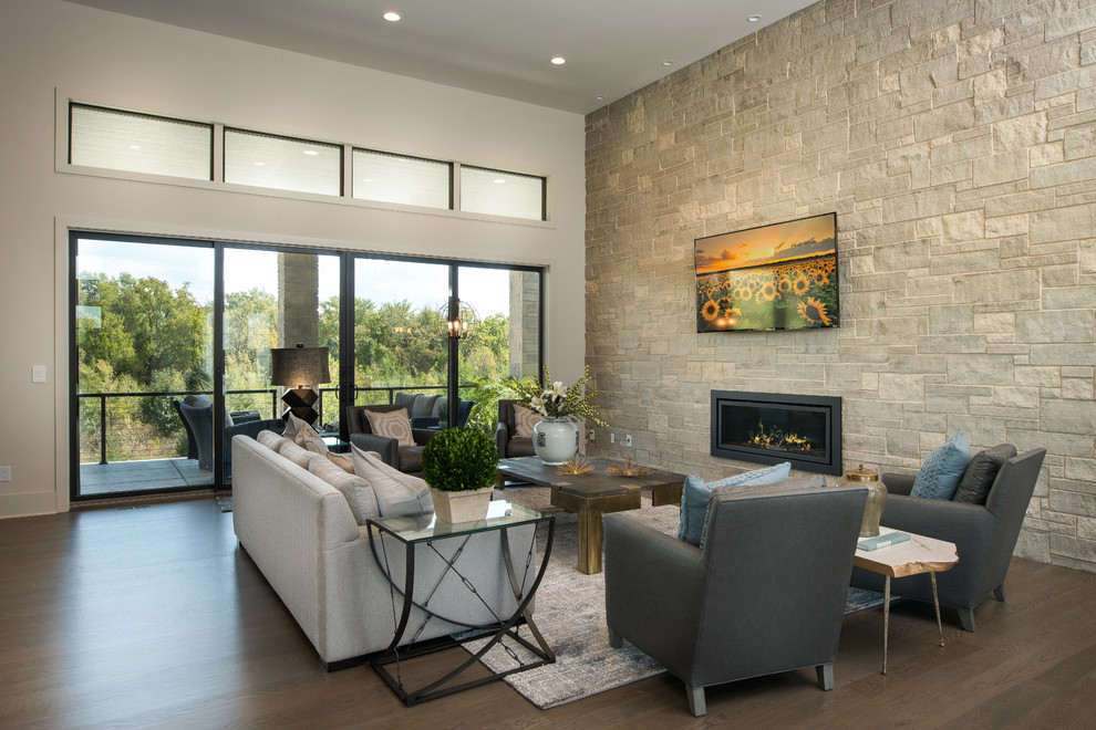 Inspiration for a large contemporary open concept medium tone wood floor living room remodel in Wichita with white walls, a ribbon fireplace and a stone fireplace