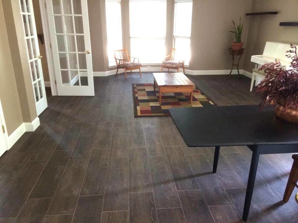 Inspiration for a large formal and open concept dark wood floor living room remodel in Dallas with beige walls and a metal fireplace