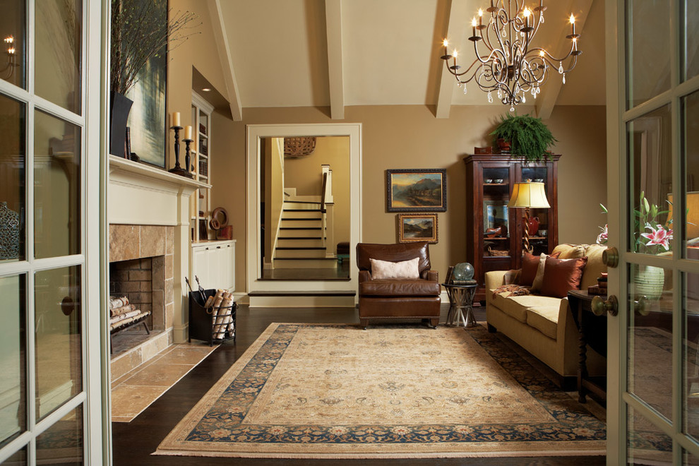 Inspiration for a mid-sized timeless enclosed and formal dark wood floor and brown floor living room remodel in Detroit with beige walls, a tile fireplace, no tv and a standard fireplace