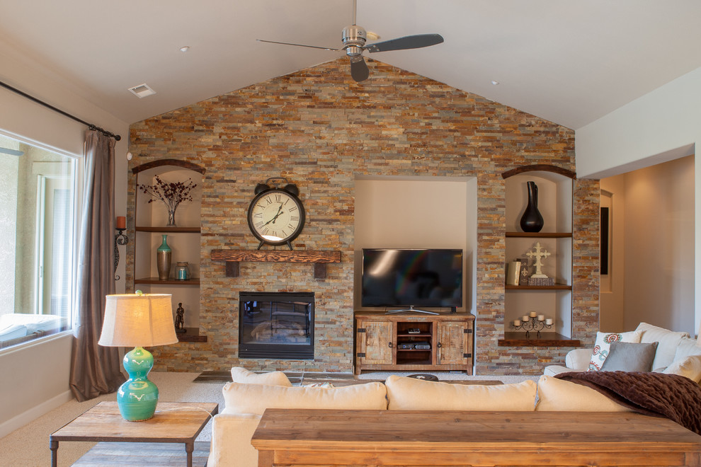 Example of a mid-sized mountain style open concept and formal carpeted and beige floor living room design in Other with beige walls, a standard fireplace, a stone fireplace and a tv stand
