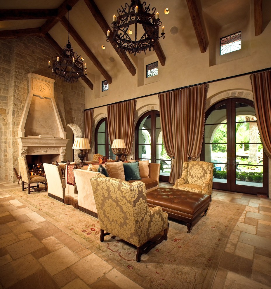 Inspiration for a large mediterranean formal open plan living room in Houston with beige walls, a standard fireplace and a stone fireplace surround.