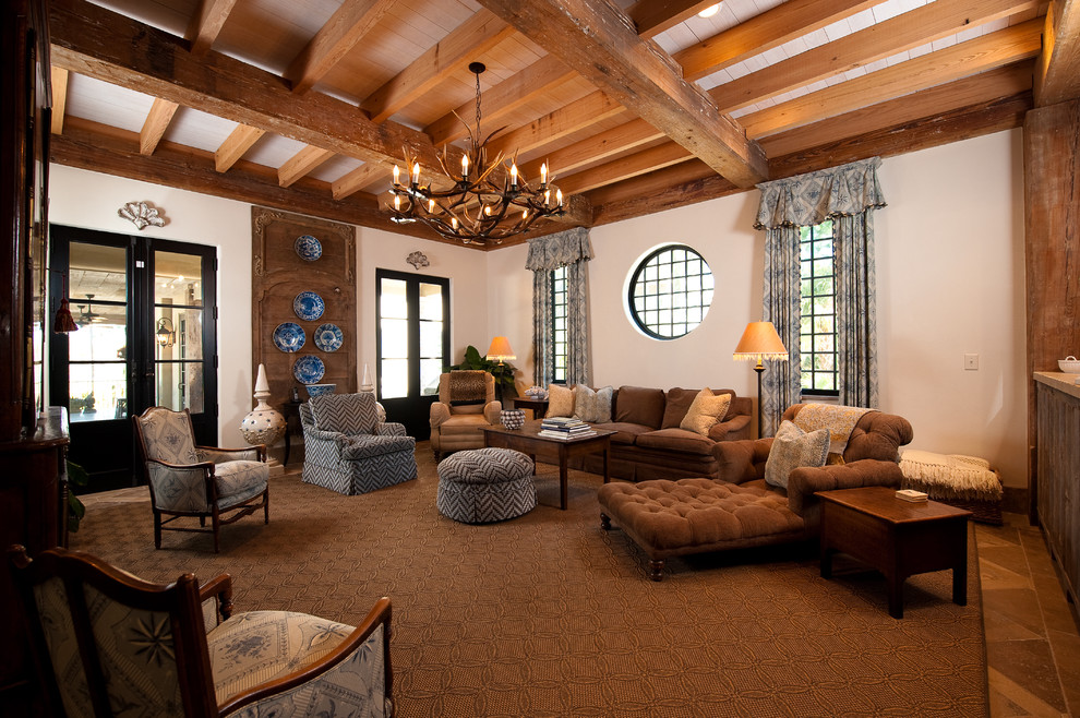 Example of a tuscan living room design in Charleston