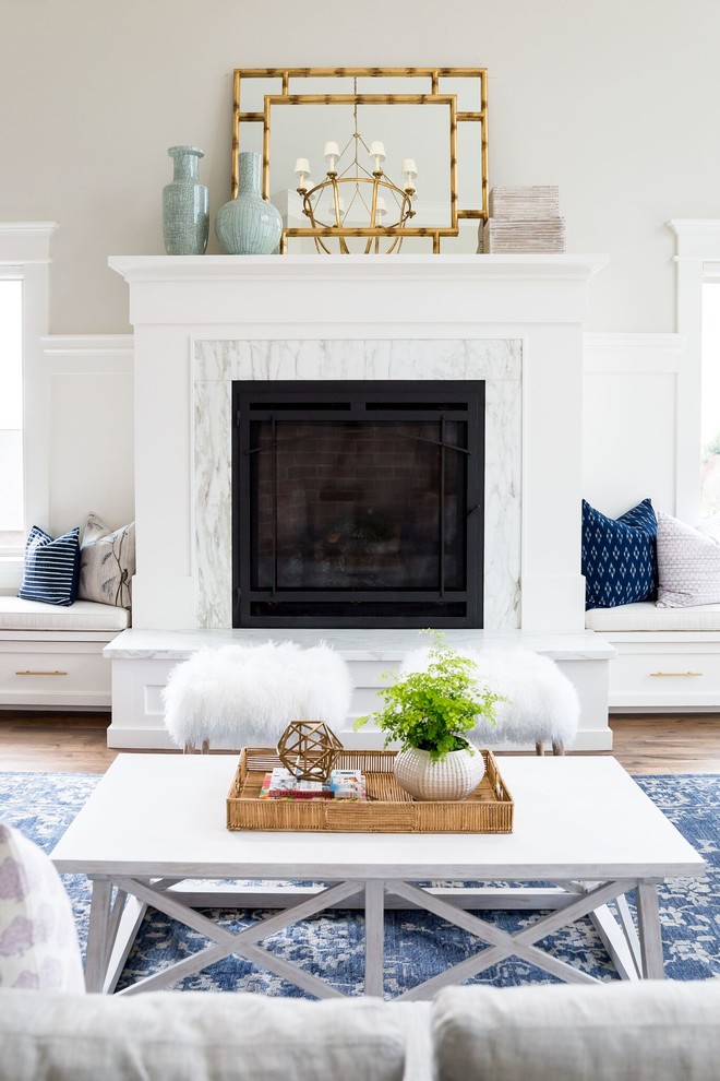 Example of a large trendy medium tone wood floor living room design in Salt Lake City with white walls and a stone fireplace