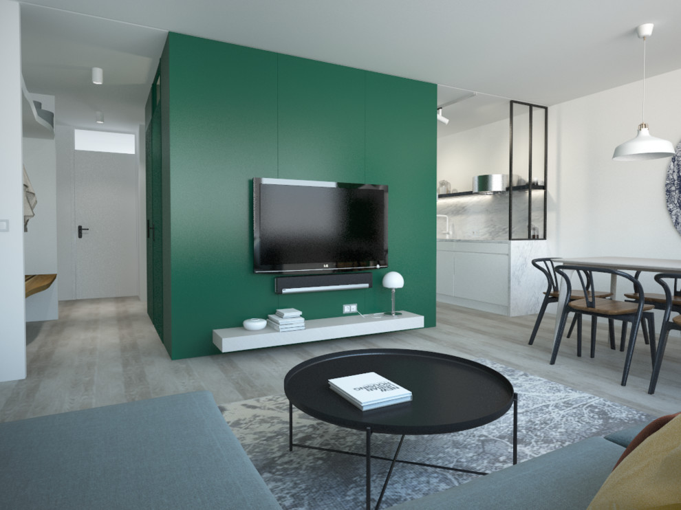 Свежая идея для дизайна: маленькая гостиная комната в современном стиле с телевизором на стене для на участке и в саду - отличное фото интерьера
