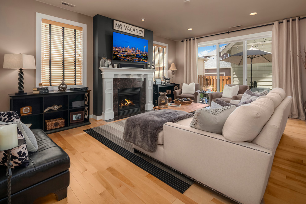 Example of a mid-sized transitional formal and open concept light wood floor and brown floor living room design in Seattle with brown walls, a standard fireplace, a stone fireplace and a wall-mounted tv
