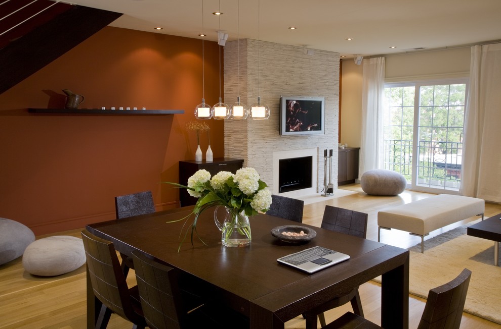 Minimalist living room photo in DC Metro with a standard fireplace and a wall-mounted tv