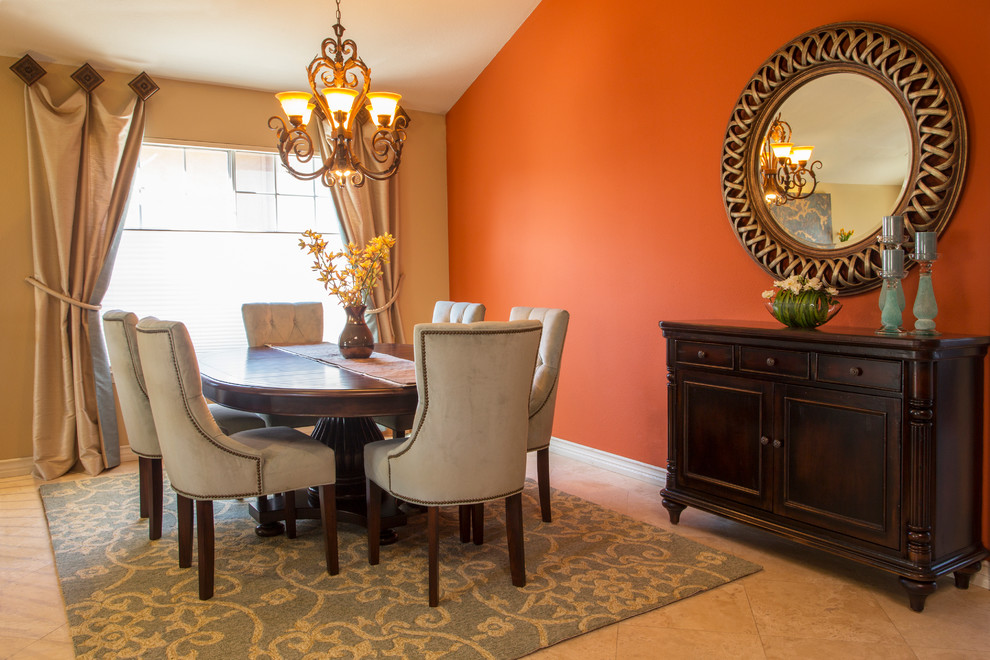 Idées déco pour une salle à manger ouverte sur la cuisine classique de taille moyenne avec un mur orange, un sol en carrelage de céramique, une cheminée standard et un manteau de cheminée en pierre.