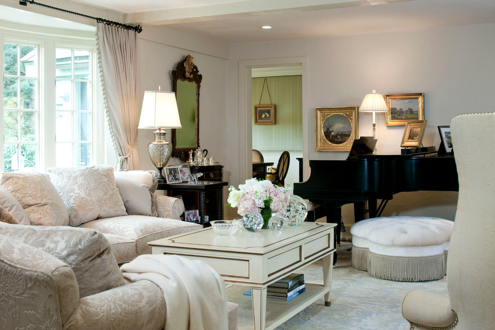 Photo of a classic formal enclosed living room in Boston with white walls and carpet.