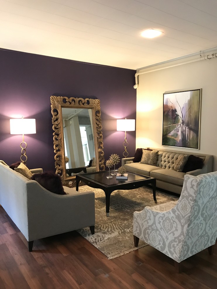 Example of a mid-sized classic formal and enclosed medium tone wood floor and brown floor living room design in Other with purple walls, no fireplace and no tv