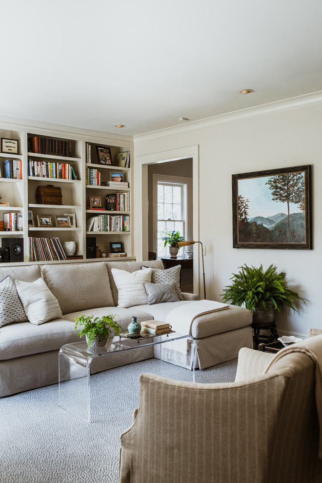 Photo of a large traditional living room in Atlanta with a reading nook, beige walls and brown floors.
