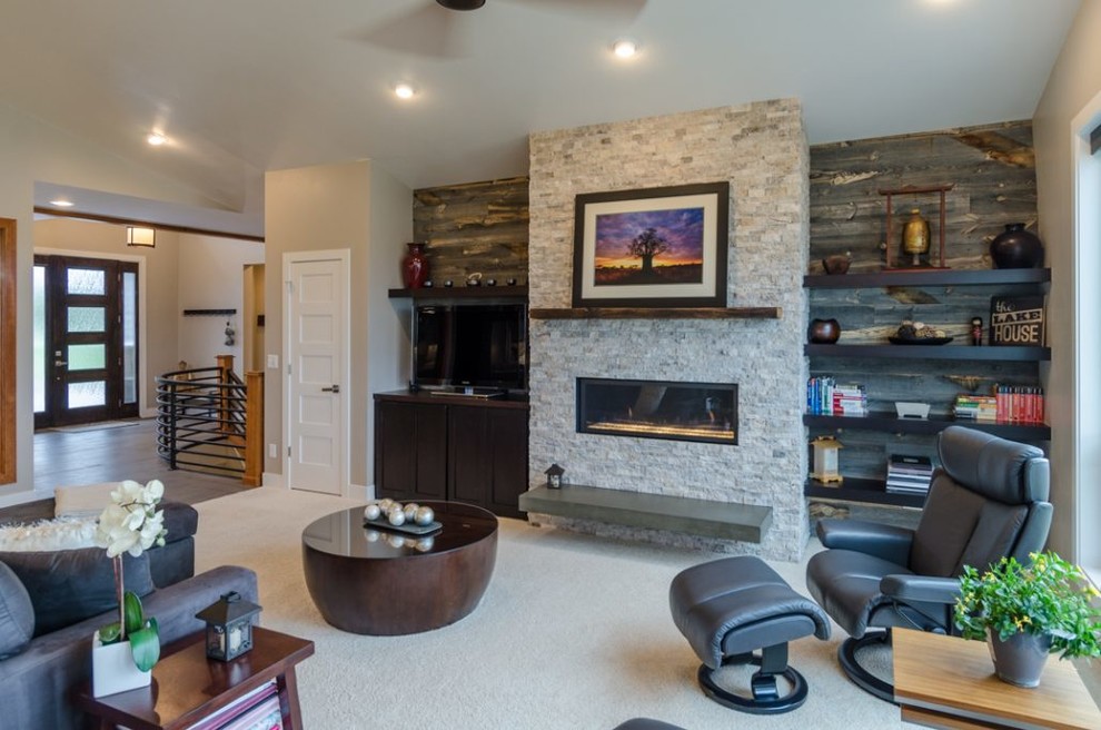 Inspiration for a mid-sized transitional open concept carpeted and white floor living room remodel in Denver with beige walls, a ribbon fireplace, a stone fireplace and a media wall