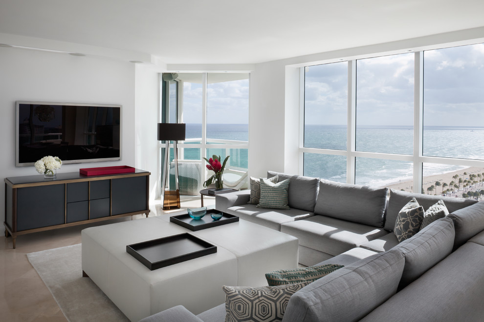Photo of a large contemporary open plan living room in Miami with white walls, ceramic flooring and a wall mounted tv.