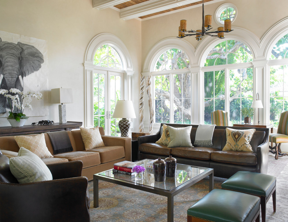 Photo of a large mediterranean open plan living room in Miami with beige walls, light hardwood flooring, no tv, beige floors and no fireplace.
