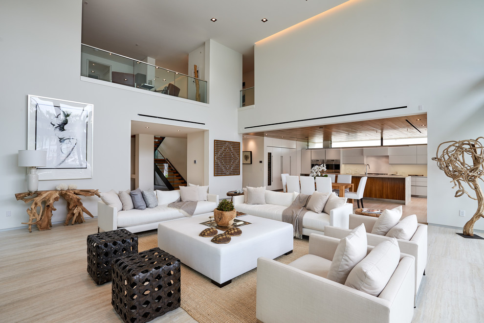 Example of a trendy formal and open concept beige floor living room design in Miami with white walls