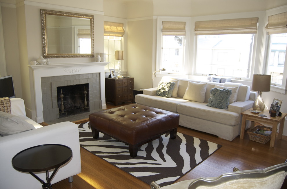 Photo of a contemporary living room in San Francisco with a tiled fireplace surround.