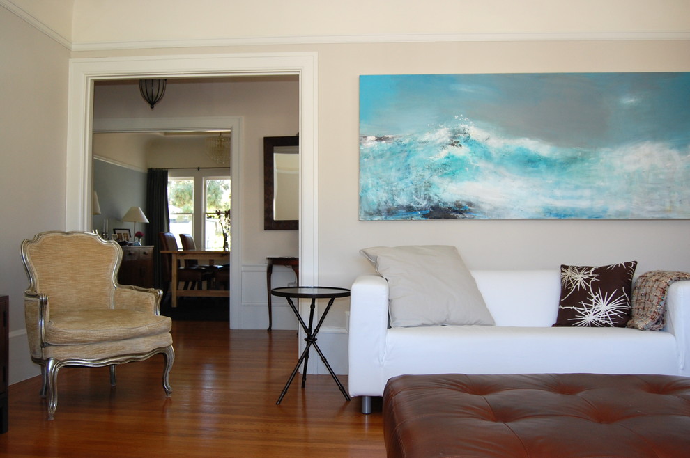 Trendy medium tone wood floor living room photo in San Francisco with gray walls