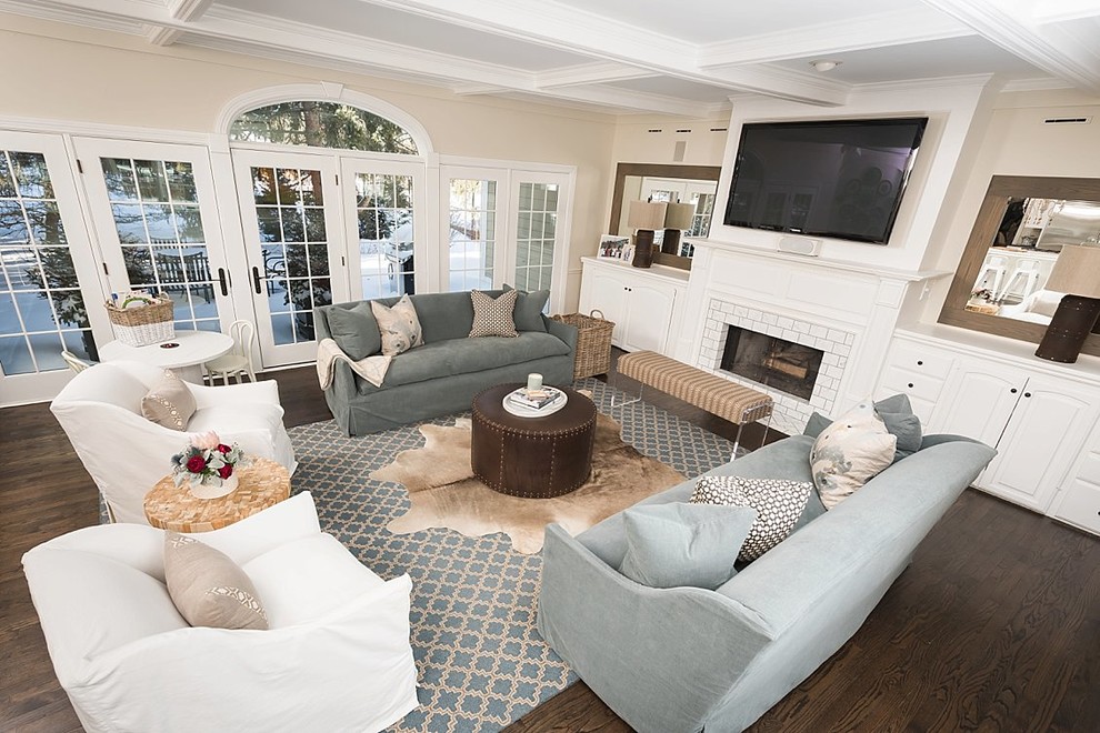 Inspiration for a mid-sized transitional enclosed living room remodel in Milwaukee with beige walls, a standard fireplace, a brick fireplace and a wall-mounted tv