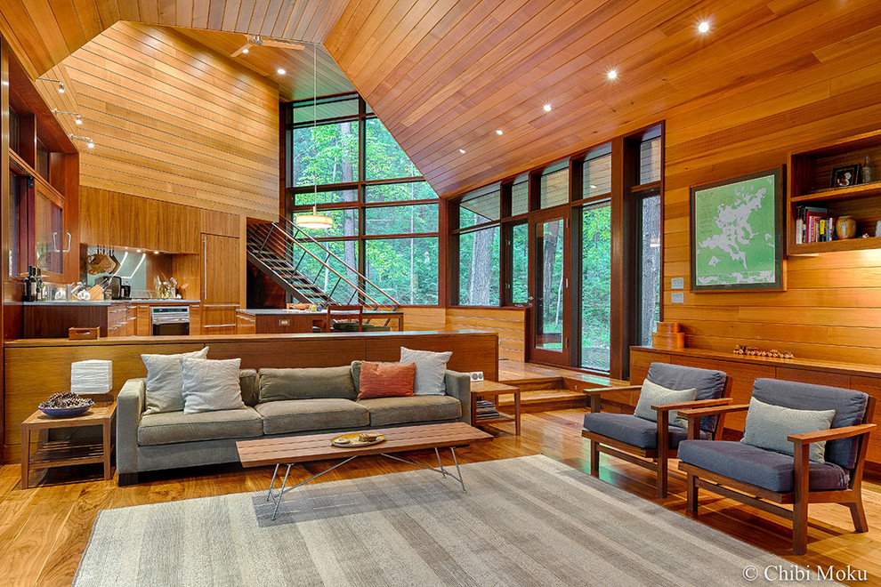 Inspiration for a medium sized modern open plan living room in Boston with dark hardwood flooring.