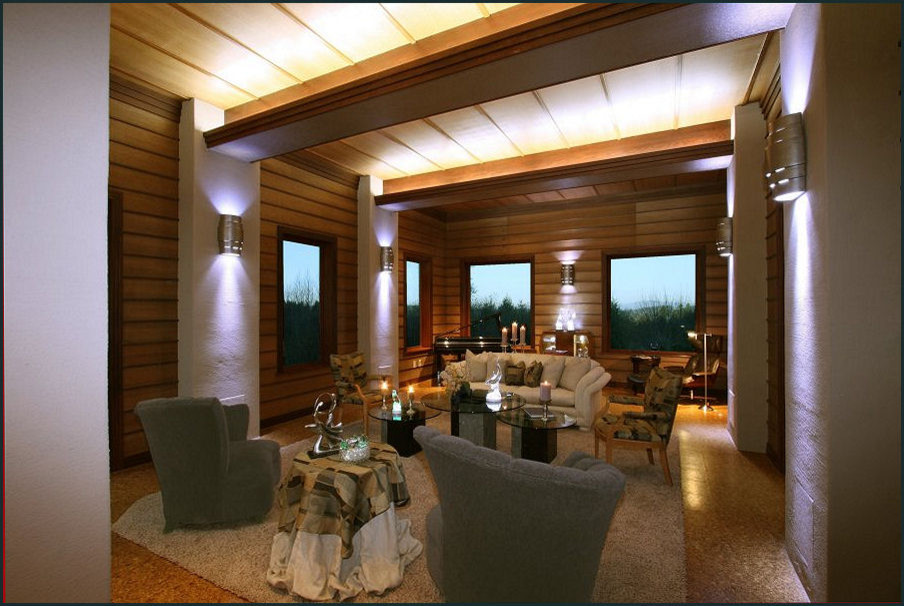 Cette image montre un grand salon vintage ouvert avec une salle de musique, un mur marron, un sol en liège, une cheminée double-face, un manteau de cheminée en plâtre et un sol marron.