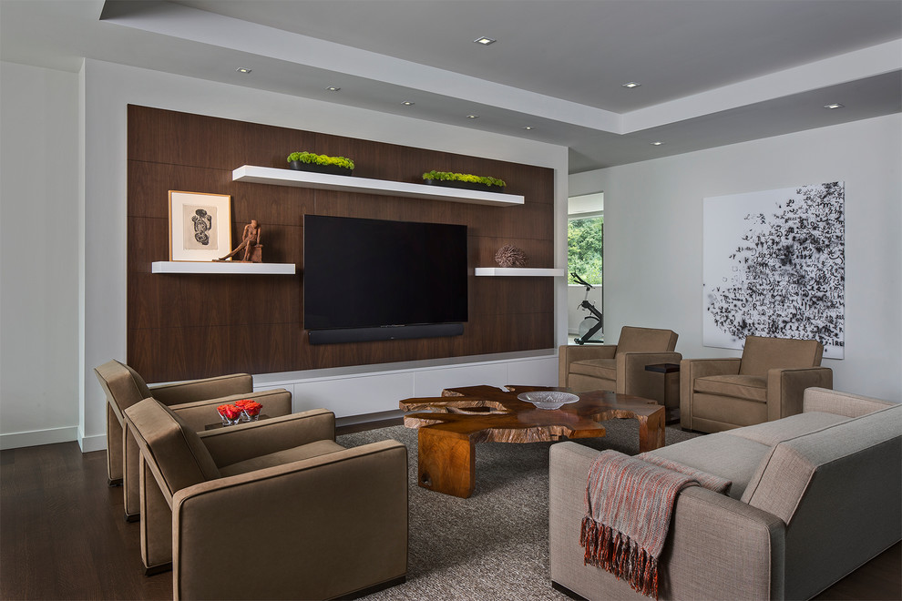 Foto de salón abierto contemporáneo de tamaño medio sin chimenea con paredes blancas, suelo de madera oscura, televisor colgado en la pared y suelo marrón
